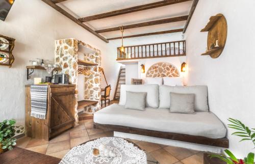 a bedroom with a bed and a table at Limeri Traditional Guest House in Monólithos