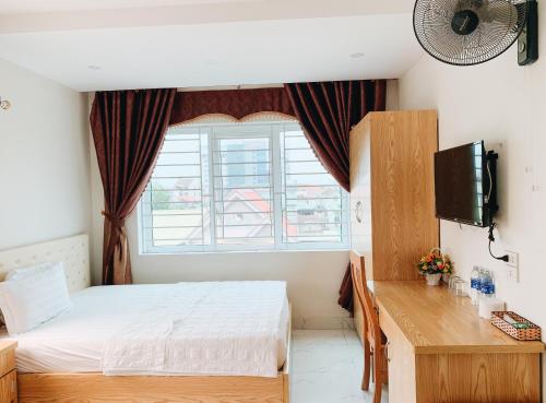 Llit o llits en una habitació de Hoang Ngan 2 Hotel - TP. Vinh