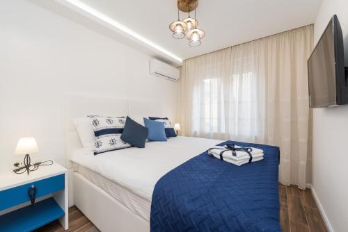 Posteľ alebo postele v izbe v ubytovaní Blue Old Navy Rooms - AE1094