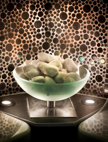 a bowl of rocks sitting on a table at Logis Hotel Restaurant Muller in Niederbronn-les-Bains