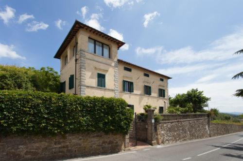 a building on the side of a street at Villa Cristina in Castellina in Chianti