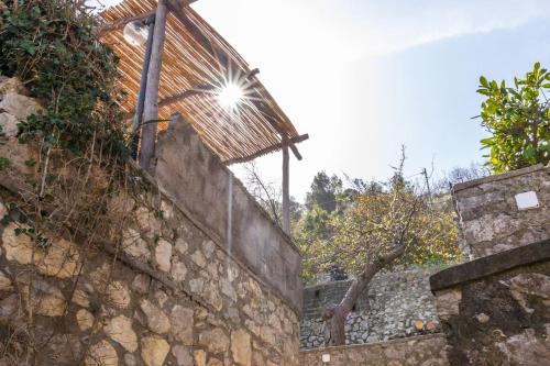 a stone wall with a light on top of it at La Gioiella Capri in Capri