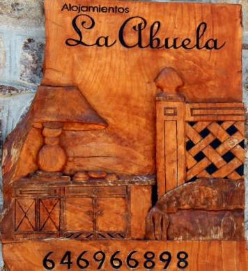 a painting of a kitchen on a wall at Alojamientos la Abuela in Rascafría