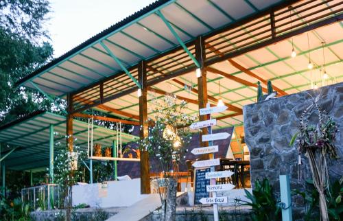a group of signs in front of a building at Makarma Resort Lombok in Senggigi 