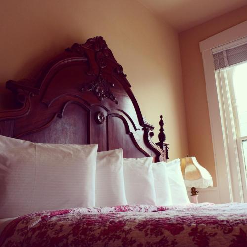 Ένα ή περισσότερα κρεβάτια σε δωμάτιο στο Grand Imperial Hotel