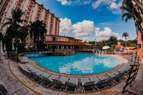a large swimming pool in front of a hotel at HOT SPRINGS HOTEL - BVTUR in Caldas Novas