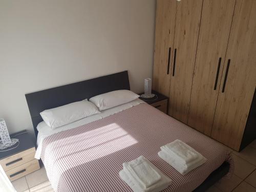 a bedroom with a bed with two white pillows at B&B il Feudo in Fontechiari