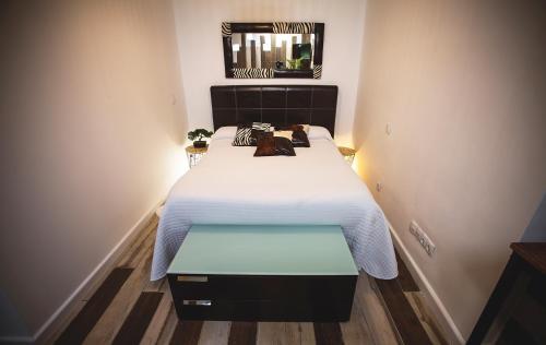 Posteľ alebo postele v izbe v ubytovaní Junior Suites con Jacuzzi