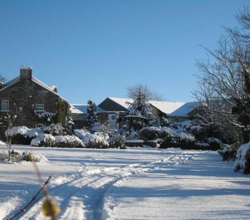 a snow covered street in front of a house at Best Western Plus Lancashire Manor Hotel in Skelmersdale