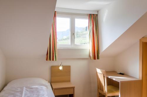 Ένα ή περισσότερα κρεβάτια σε δωμάτιο στο Garni Hotel Ritterhof