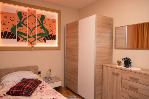Una cama o camas en una habitación de Rooms Vlado