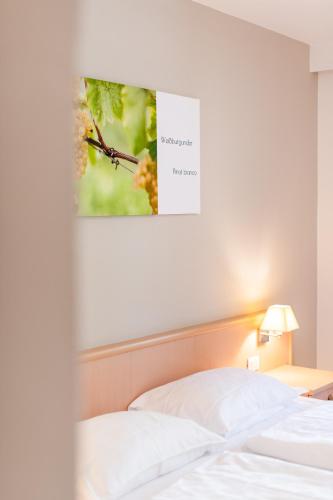 Ένα ή περισσότερα κρεβάτια σε δωμάτιο στο Garni Hotel Ritterhof