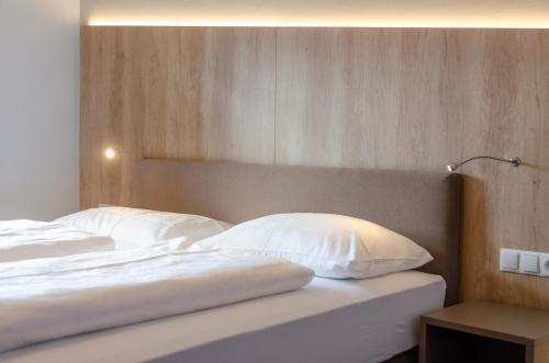 Ένα ή περισσότερα κρεβάτια σε δωμάτιο στο Garni Hotel Ritterhof