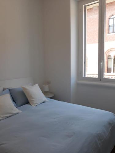 Ліжко або ліжка в номері Appartamento con vista