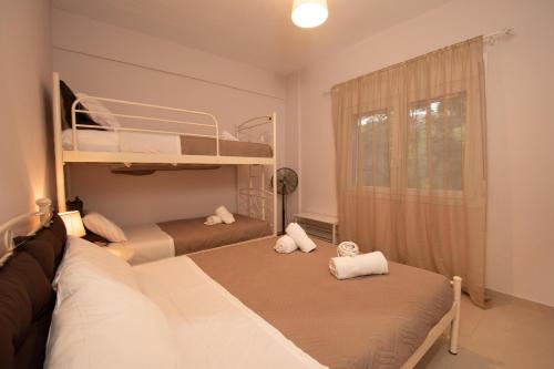 Postel nebo postele na pokoji v ubytování Seaside Apartments-Cristina