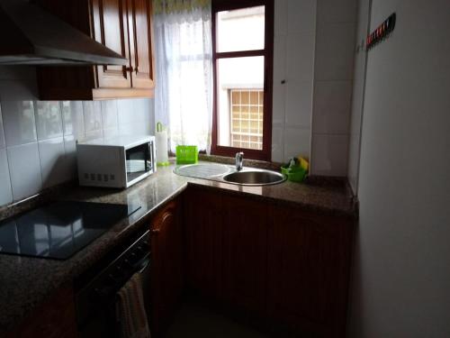 A kitchen or kitchenette at Edificio SATI 1 A