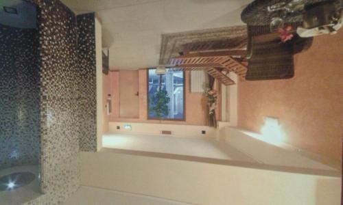 a bathroom with a sink and a window at Hotel Cristallo Cerreto Laghi in Cerreto Laghi
