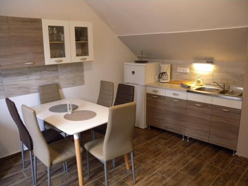 A kitchen or kitchenette at Apartments in Balatongyörök 34590