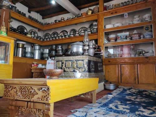 a kitchen filled with lots of pots and pans at amir homestay in Leh