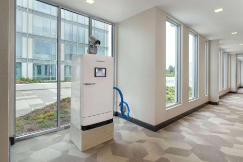an empty hallway with a water dispenser in a building at The Summit Hotel in Cincinnati