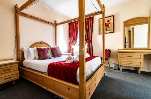 Postelja oz. postelje v sobi nastanitve OYO Paddington House Hotel