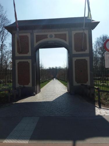 an archway at the entrance to a park at Quiet apartment in Antwerp near parc - B&B InterMezzo - business & leisure in Antwerp