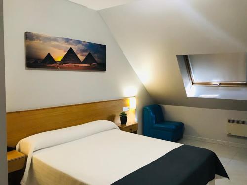 מיטה או מיטות בחדר ב-Hotel Bradomin