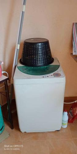a cake sitting on top of a white refrigerator at Desa Impian Tanah Merah Homestay in Tanah Merah
