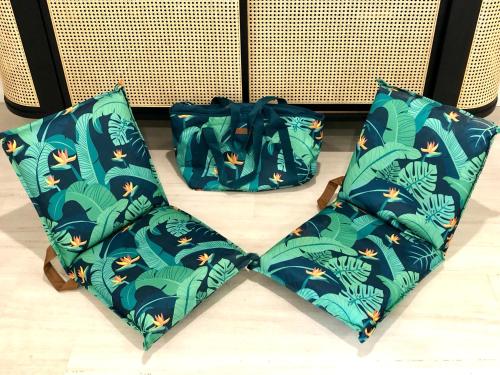 a pair of bags sitting on the floor at NOMAD - Luxe apartment in Port Douglas