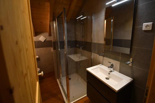 a bathroom with a sink and a shower at chalet perché in LʼHuez
