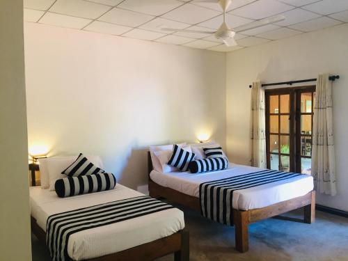 Postel nebo postele na pokoji v ubytování Jaye Eco Lodge