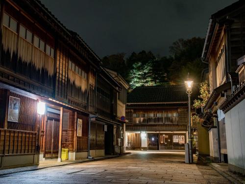 an empty street at night with a street light at Maki No Oto Kanazawa in Kanazawa
