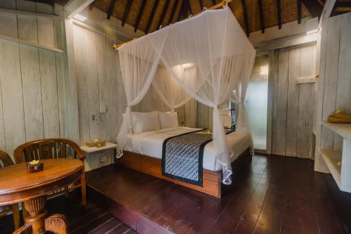 Кровать или кровати в номере Green Taman Ubud by Prasi