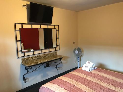 Postel nebo postele na pokoji v ubytování Motel El Refugio