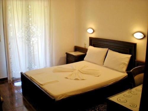 Postel nebo postele na pokoji v ubytování Olympion Apartments