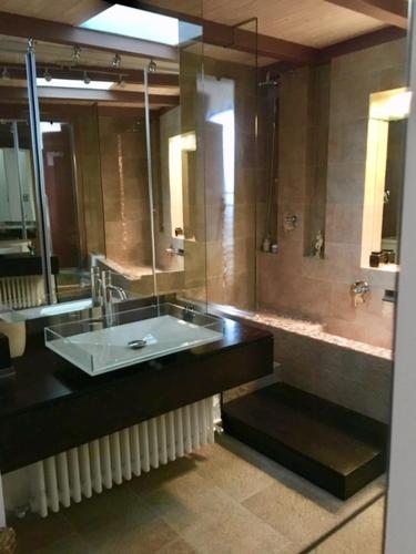 a bathroom with a sink and a shower at 202 luxury terrace view in Taormina