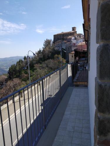 a balcony of a house with a view of a road at La Casa dei Panorami di Colobraro in Colobraro