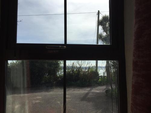 a view out of a window of a door at Redington House SelfCatering accommodation in Cobh