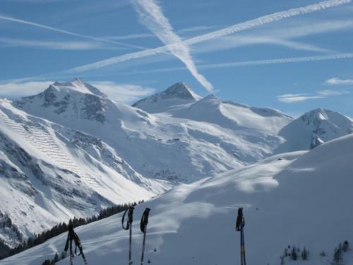 a view of a snow covered mountain range with ski poles at Ferienwohnung Irene in Tux