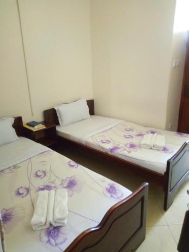 Postel nebo postele na pokoji v ubytování Snow View Hotel Boma