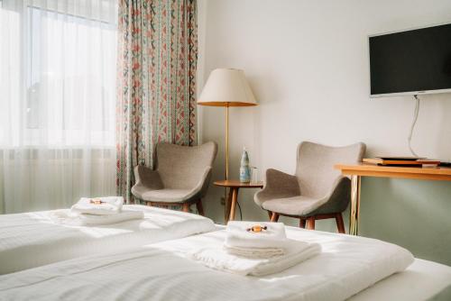 Кровать или кровати в номере Hotel Radau