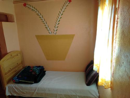 Katil atau katil-katil dalam bilik di Auberge Aain Nakhla