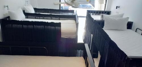 a group of four bunk beds in a room at Chaweng best hotel and hostel samui in Chaweng