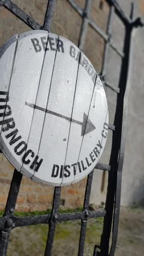 a sign on the top of a metal fence at No42 Wild Goose in Dornoch