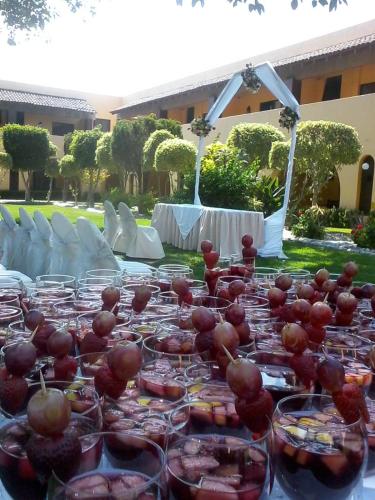 a long table with bowls of food on it at Casa Cantarranas in Tehuacán