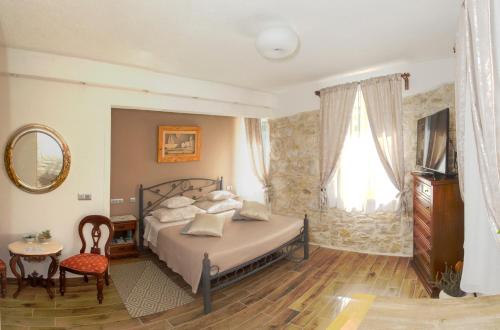 a bedroom with a bed and a large window at Bossa Studio Apartments in Split