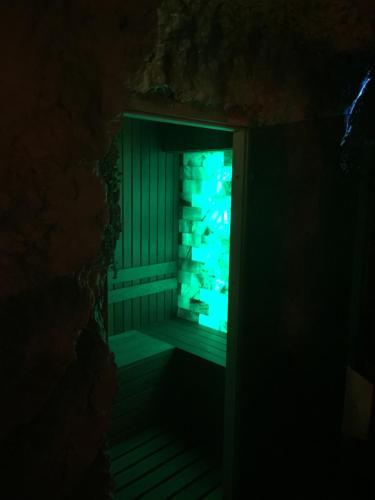 a room with a window in a cave at Gorgeous Villa in Cluj-Napoca