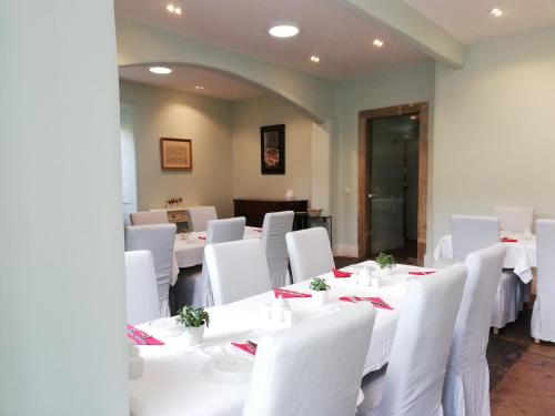 a room with white tables and white chairs at Casa Holstein Quinta de Sao Sebastiao Sintra in Sintra