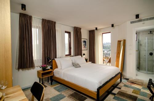 Postel nebo postele na pokoji v ubytování Biazi Hotel