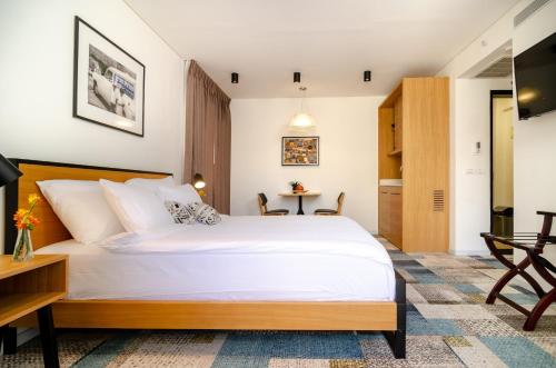 Postel nebo postele na pokoji v ubytování Biazi Hotel